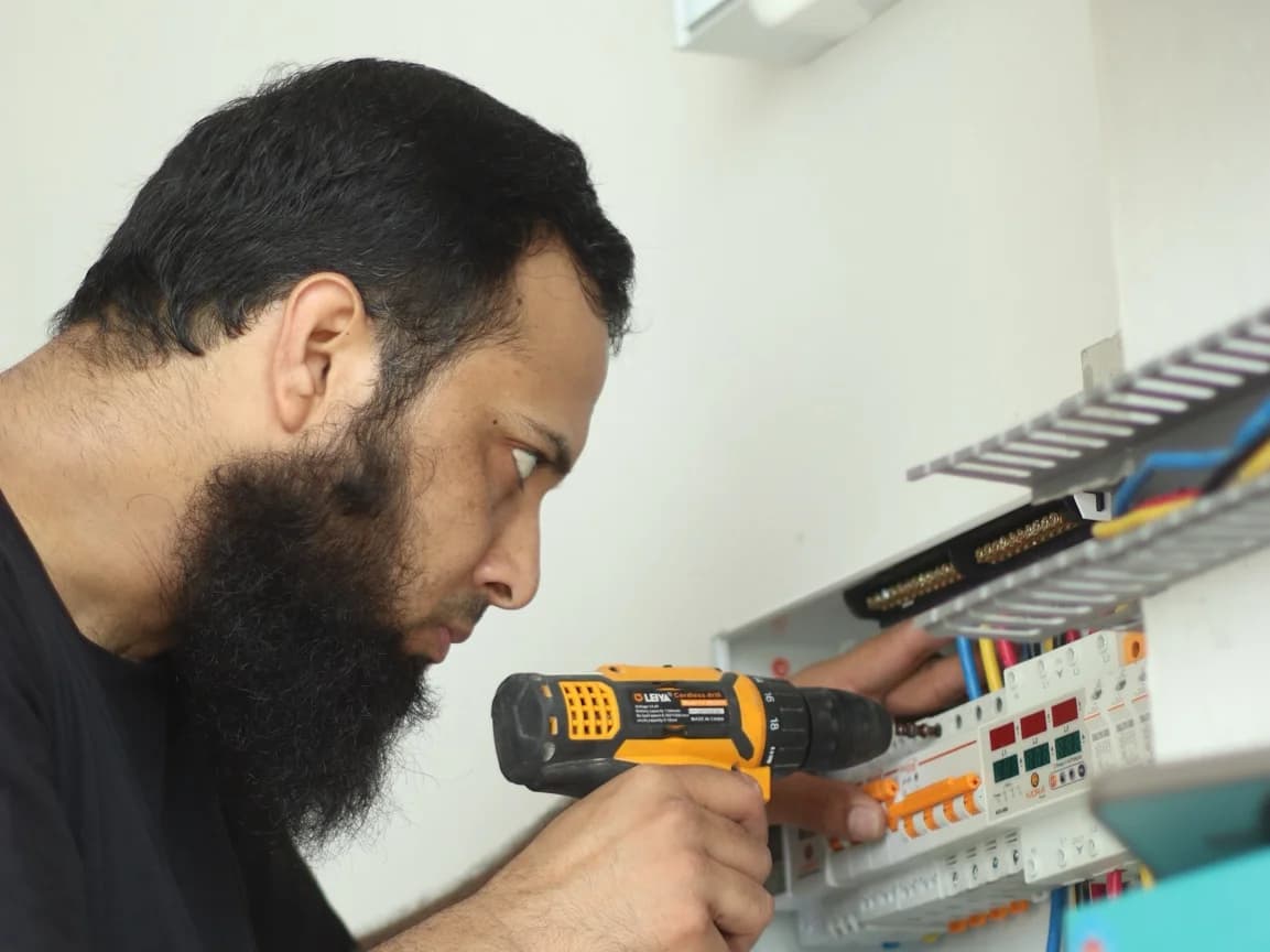 Eco Life Solars engineer working on electrical installation